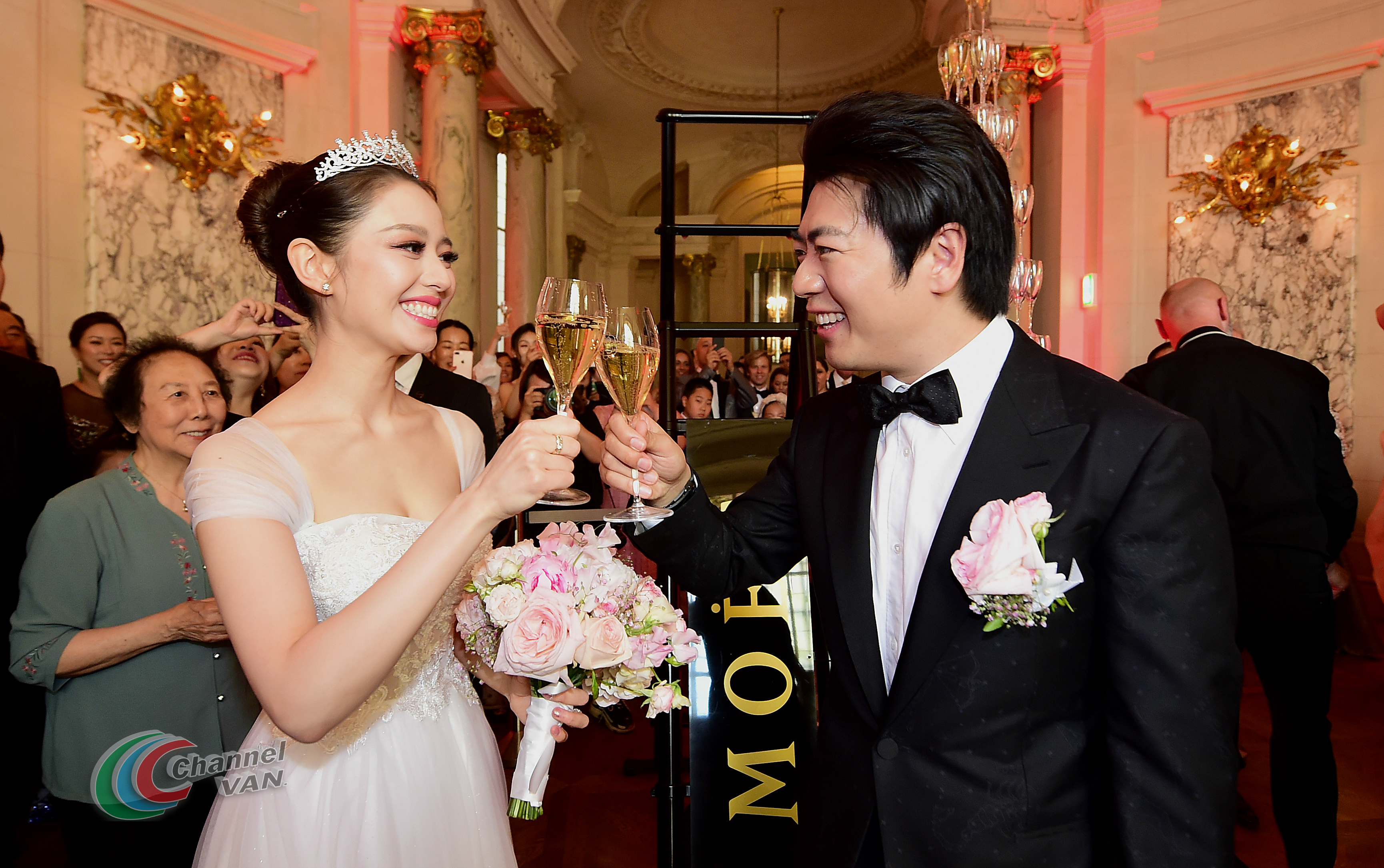 PARIS, FRANCE - JUNE 02: Pianists Lang Lang & Gina Alice drink a glass of Moet et Chandon Champagne during their Cocktail Wedding at Hotel Shangri-La on June 02, 2019 in Paris, France. (Photo by Anthony Ghnassia/Getty Images for Moet Henessy)