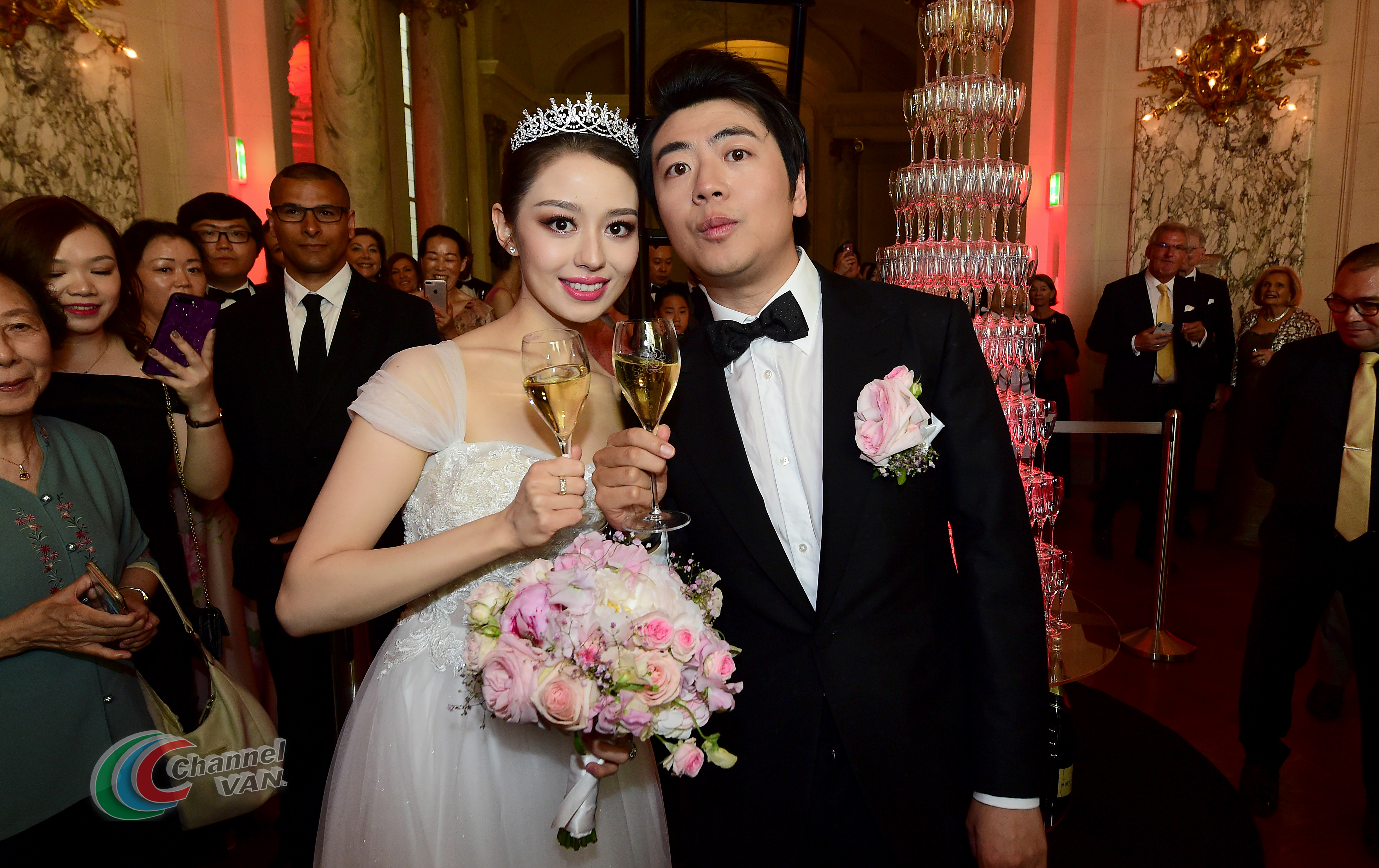 PARIS, FRANCE - JUNE 02: Pianists Lang Lang & Gina Alice drink a glass of Moet et Chandon Champagne during their Cocktail Wedding at Hotel Shangri-La on June 02, 2019 in Paris, France. (Photo by Anthony Ghnassia/Getty Images for Moet Henessy)